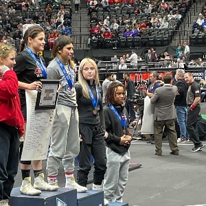 Adrianna Lopez standing on 2nd place podium